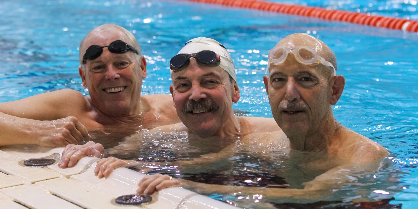 A group of seasoned masters program swimmers enjoy some leisure time