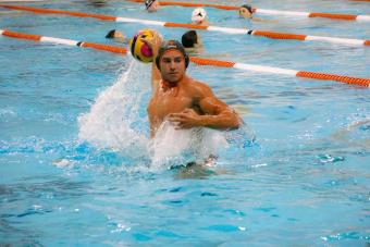 Water polo athlete prepares to throw ball.