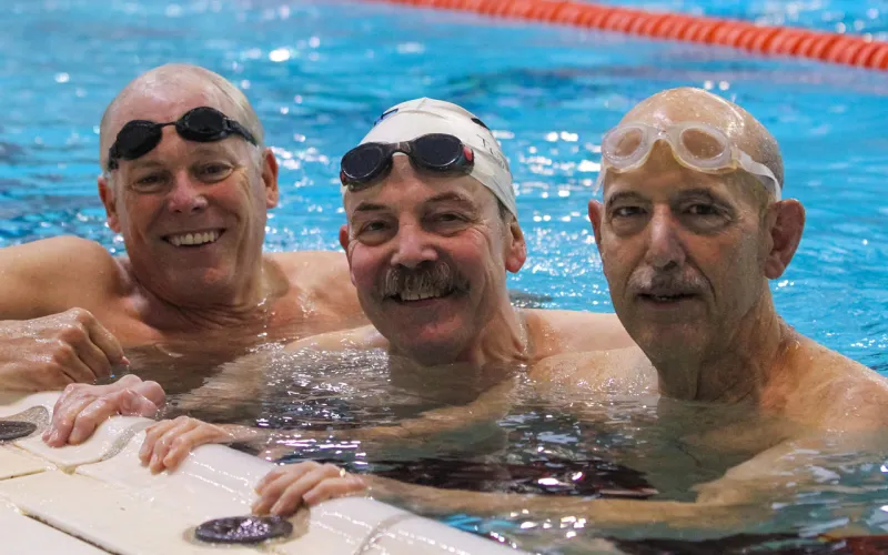 A group of seasoned masters program swimmers enjoy some leisure time