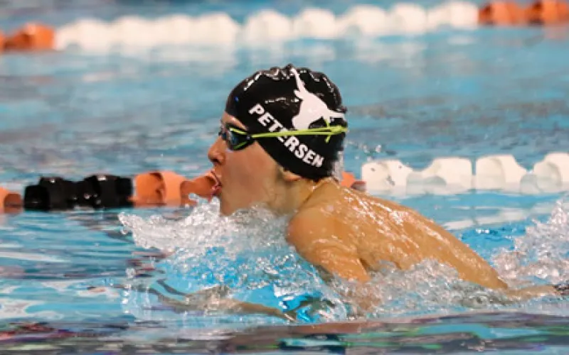 longhorn swimmer doing laps in lane